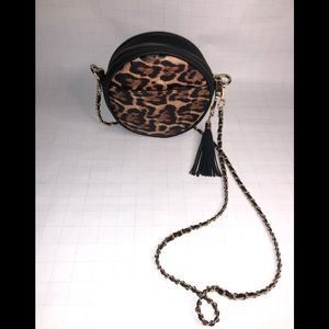 Round cheetah print crossbody with black tassel